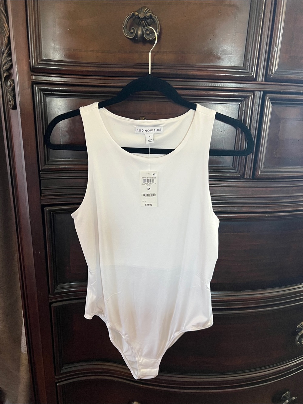 And Now This White Sleeveless Bodysuit – Modern Tank Style